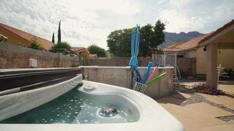 Tracking Shot Over a Backyard Hot Tub Stock Footage 116502265