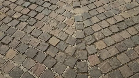 Tracking Shot Over Curved Cobblestone Pavement With Natural Stone Pattern Stock Footage 340972111