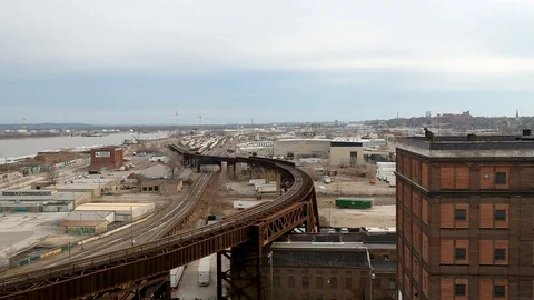 Tracking shot over curved train track that elevates Stock Footage 104876149