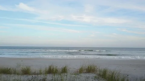 Tracking Shot over A Dune to the Beach Stock Footage 80296191