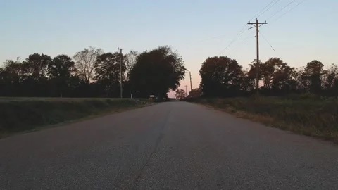 Tracking shot over narrow paved road Stock Footage 131341410