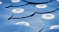 tracking shot over a pile of discs 3/8 4k or 4k+ Resolution