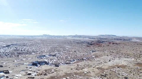 Tracking shot over snow covered rocks in high desert Stock Footage 209160865