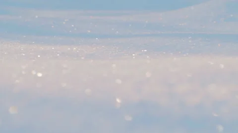 Tracking shot over sparkling fresh snow in the sun (4K) Video stock 222737803