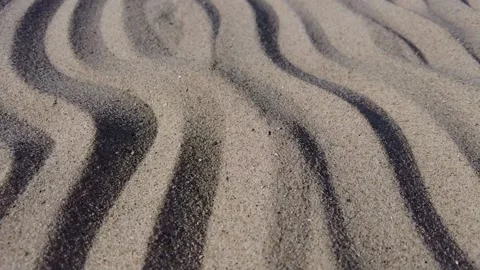Tracking shot over waves of sand Stock Footage 161458488