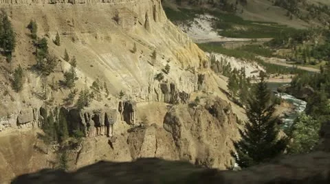 Tracking shot passing cliffs in Yellowstone Stock Footage 21887526