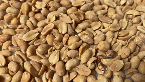 Tracking shot on peanuts in top view ful Stock Footage 310624163