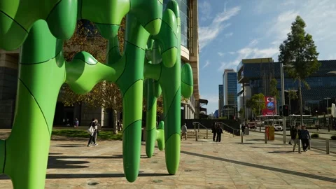 Tracking shot Perth shoppers pass The Cactus sculpture 6K Stock-Footage 311969010