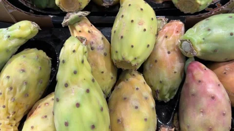 Tracking shot on prickly pears displayed in crate Video stock 317653504