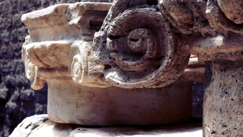 Tracking shot on the remains of capitals of ionic column capitals Stock Footage 90135596