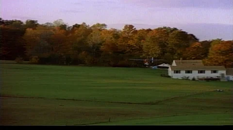 Tracking shot right to left of ultra light plane flying by Stock Footage 29804810