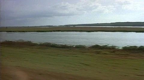 Tracking shot of river with boat Stock Footage 29804524