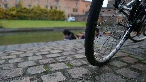 Tracking shot by the river in Cambridge, bicycle in the footage Stock Footage 99459297