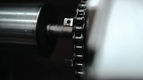 Tracking shot of roller and chain inside printing machine Stock Footage 135269765
