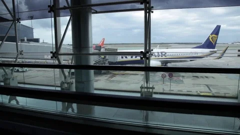 Tracking shot of the runaway from inside the building. At Barcelona airport. Stock Footage 71446113