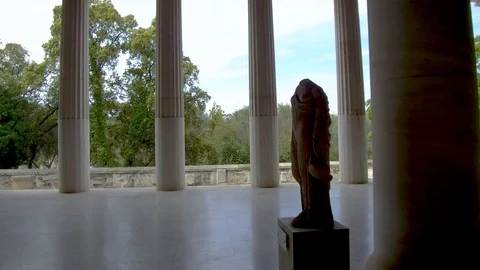 Tracking shot side view camera moves in interior length of Stoa of Attalos Stock Footage 92438955