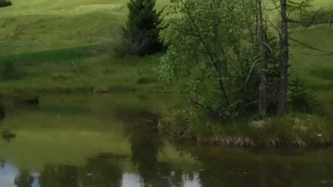 Tracking shot slow motion Valacia lake,Alta Badia Stock Footage 79303732