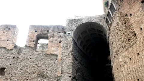 Tracking shot on a small arch in the ruins of Avventino, in the center of Rome Video stock 89907274