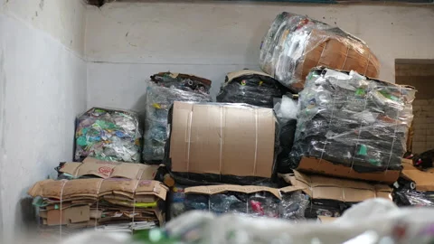 Tracking shot of sorted cardboard waste ready for reprocessing. Garbage from 库存影片 220925611