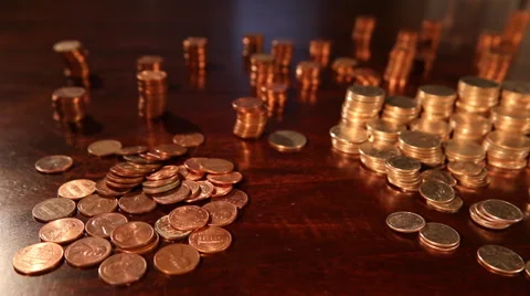 Tracking shot of stacks of quarters, dimes, nickles - Tight Focus Vidéo 56931238