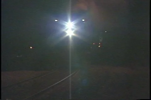 Tracking shot of a steam train approaching and passing in the dark. Stock-Footage 340872