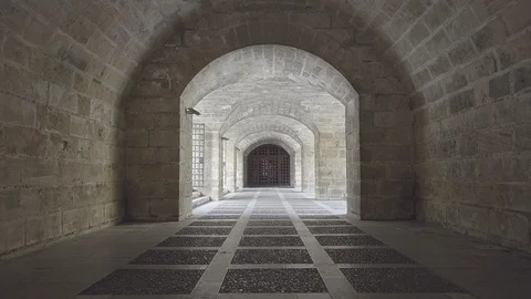 Tracking shot in a stone passageway in Palma de Mallorca Stock Footage 118661929