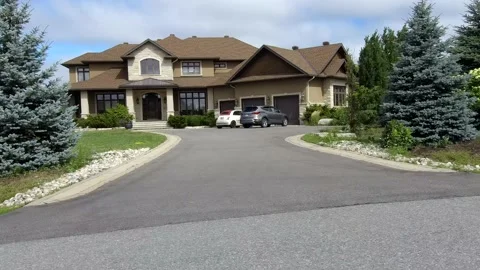 Tracking shot of a street of luxury homes in the suburb 4K Stock Footage 136593353