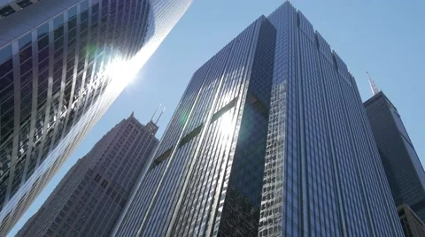 Tracking shot of sun reflecting highrises in Chicago Stock Footage 54907591