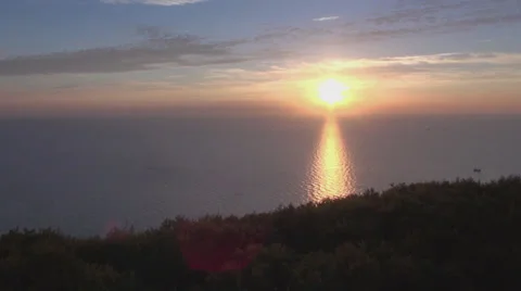 Tracking Shot From Sundown Over The Ocean To Beech Grove Trees Stock Footage 37611051