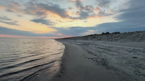 Tracking shot of sunset over the Baltic Sea: tranquil beach scene in Graal-.. Stock Footage 309212663