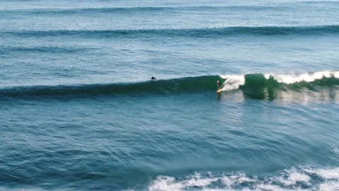 Tracking shot of surfer on a long wave Stock Footage 161379927