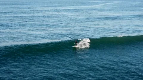 Tracking shot of a surfer weaving on a wave Stock Footage 161379913