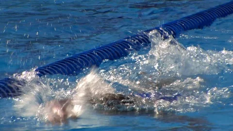 Tracking Shot of Swimmer in Pool Stock Footage 85833511
