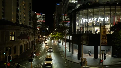 Tracking shot Sydney night traffic passes Fitness First 6K Stock Footage 310713439