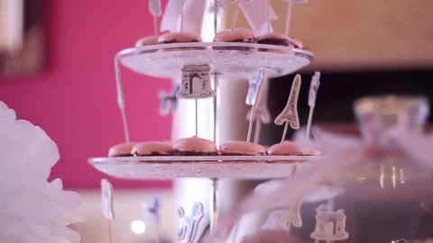 Tracking shot on a table with wedding decorations, flowers, pastries, macarons Stock Footage 96516699