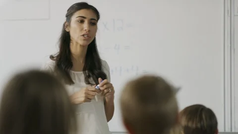 Tracking shot of teacher questioning students in math class ,Provo, Utah, United Stock Footage 85911443