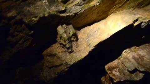 Tracking shot through dark cave system in czech republic Stock Footage 40021550