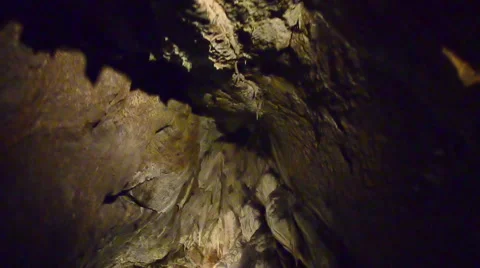 Tracking shot through dark cave system in czech republic Stock Footage 40023475