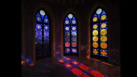 Tracking shot through doors opening revealing large arched stained glass Stock Footage 338099153