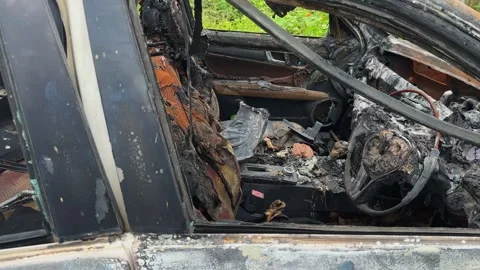 Tracking Shot Through Driver Side Window Showing Fire Damaged Car Interior Stock Footage 342590031