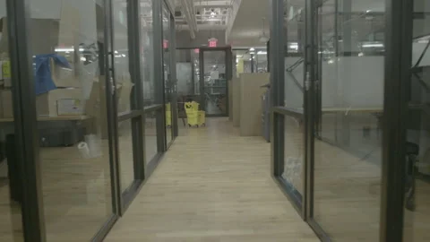 Tracking Shot Through Modern Glass Office Hallway Stock Footage 343880181