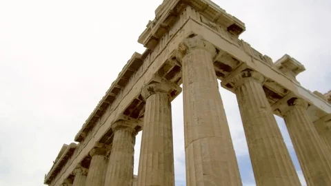 Tracking shot tilt down camera moves around parthenon acropolis in Athens Stock Footage 92437863