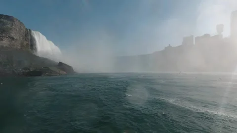 Tracking shot toward Niagara Falls, water churning under heavy mist Stock Footage 320002795