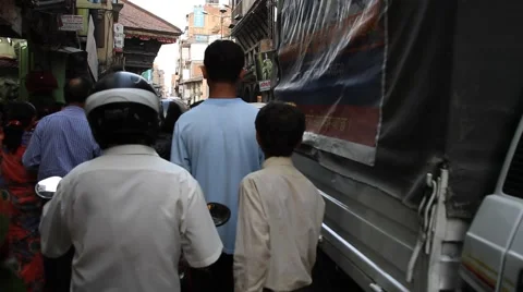 Tracking shot of Traffic jam on narrow alley in Kathmandu Stock Footage 41937849