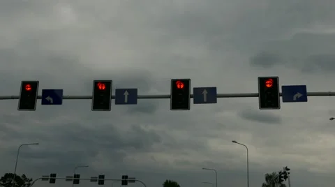 Tracking shot of traffic light from the car driver POV -from red to green and go Stock Footage