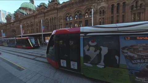 Tracking shot of tram outside Queen Victoria Building in Sydney CBD Stock Footage 251499834