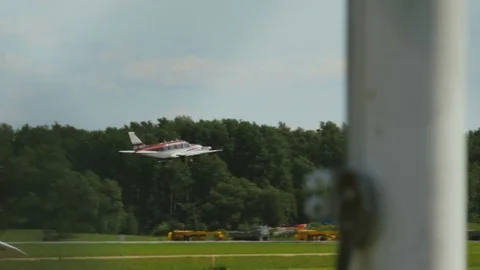 Tracking Shot Twin Engine Red and White Piper Aircraft During Sunny Stock Footage 99376160