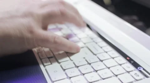 Tracking shot of typing on laptop computer keyboard Stock Footage 10593962