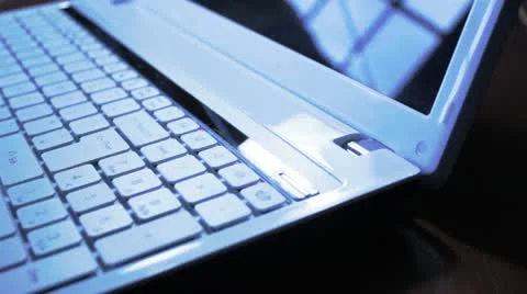 Tracking shot typing on laptop computer keyboard Vidéo 10593999