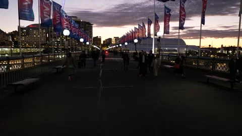Tracking shot walking towards sunset light on Pyrmont bridge in Sydney 6K Stock-Footage 310713162